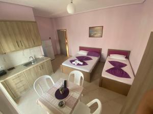 Postel nebo postele na pokoji v ubytování Hotel Vila Ali