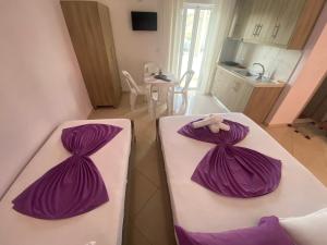 Postel nebo postele na pokoji v ubytování Hotel Vila Ali