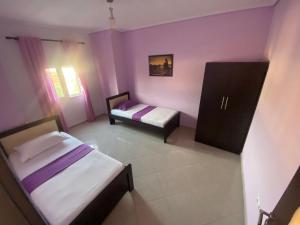 Postel nebo postele na pokoji v ubytování Hotel Vila Ali