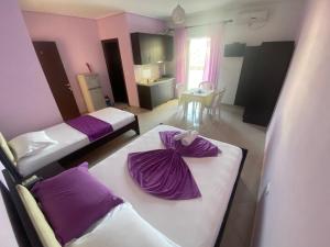 Postel nebo postele na pokoji v ubytování Hotel Vila Ali