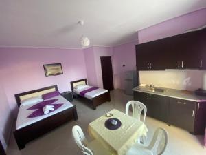 Postel nebo postele na pokoji v ubytování Hotel Vila Ali