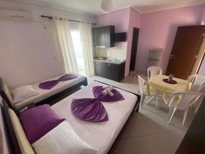 Postel nebo postele na pokoji v ubytování Hotel Vila Ali