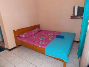 Letto o letti in una camera di Hotel Putra Sindang Asih