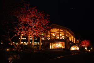 a building lit up at night with lights at Hotel Fuki no Mori in Nagiso