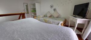 Кровать или кровати в номере Vidorra Calafate