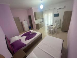 Postel nebo postele na pokoji v ubytování Hotel Vila Ali