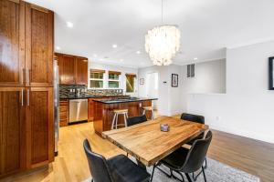 a kitchen and dining room with a wooden table and chairs at Queen Anne Charmer in Seattle