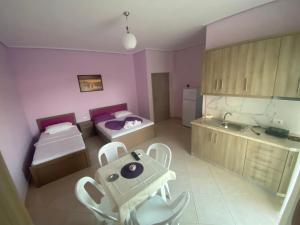 Postel nebo postele na pokoji v ubytování Hotel Vila Ali