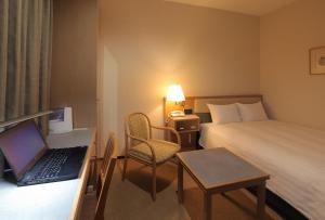 Postel nebo postele na pokoji v ubytování Odakyu Station Hotel Hon-Atsugi