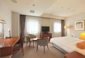 TV a/nebo společenská místnost v ubytování Odakyu Station Hotel Hon-Atsugi