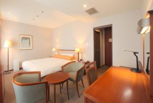 Postel nebo postele na pokoji v ubytování Odakyu Station Hotel Hon-Atsugi