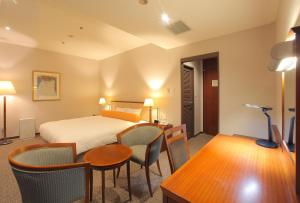 Postel nebo postele na pokoji v ubytování Odakyu Station Hotel Hon-Atsugi