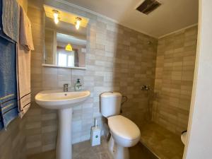 Ванная комната в Sunset view Rooms
