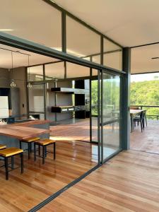 a large room with glass doors and a wooden floor at Casa de campo in Villa San Nicolás