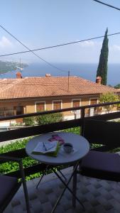 a table with a book on top of a balcony at Villa Maria in Opatija