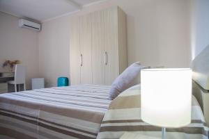 A bed or beds in a room at BluRiva Hotel