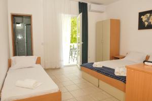 Postel nebo postele na pokoji v ubytování Guest House Marković
