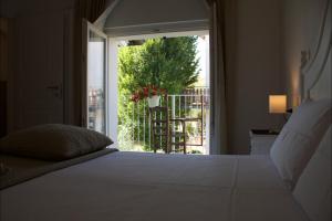 Ένα ή περισσότερα κρεβάτια σε δωμάτιο στο Casa Speri