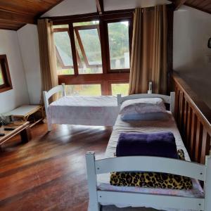 Un pat sau paturi într-o cameră la Granja das Rosas