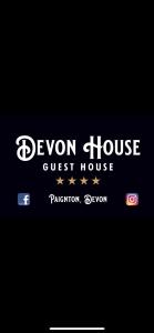 una señal para una casa de huéspedes devon en Devon House Guest House, en Paignton