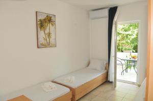 Postel nebo postele na pokoji v ubytování Guest House Marković