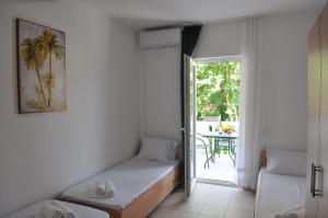 Postel nebo postele na pokoji v ubytování Guest House Marković