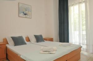 Postel nebo postele na pokoji v ubytování Guest House Marković