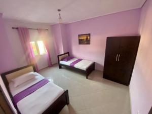 Postel nebo postele na pokoji v ubytování Hotel Vila Ali