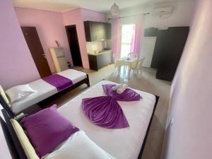 Postel nebo postele na pokoji v ubytování Hotel Vila Ali
