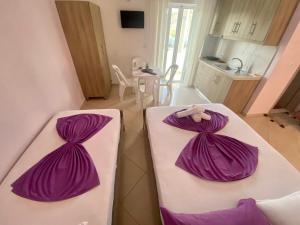 Postel nebo postele na pokoji v ubytování Hotel Vila Ali