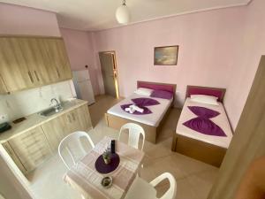 Postel nebo postele na pokoji v ubytování Hotel Vila Ali