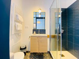 a bathroom with a sink and a shower at Hotel Saint-Michel in Dinard +71 photos