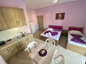 Postel nebo postele na pokoji v ubytování Hotel Vila Ali