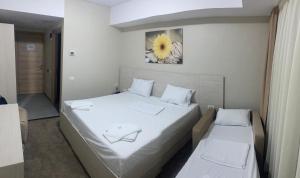 Postel nebo postele na pokoji v ubytování Hotel Alis