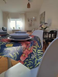 a dining room with a table with plates on it at alMirante Burgos Centro Tranquila y con encanto Como en casa in Burgos