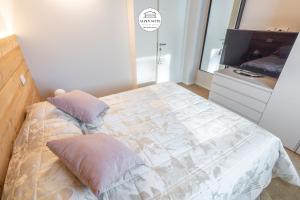 Кровать или кровати в номере B&B Alpen Suite Ponte di Legno