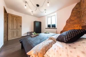 Posteľ alebo postele v izbe v ubytovaní Apartament Wita Stwosza