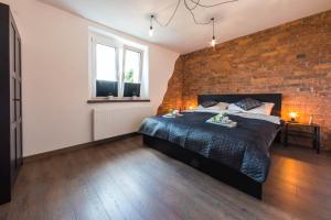 Posteľ alebo postele v izbe v ubytovaní Apartament Wita Stwosza