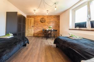 Posteľ alebo postele v izbe v ubytovaní Apartament Wita Stwosza