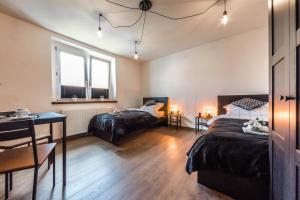 Posteľ alebo postele v izbe v ubytovaní Apartament Wita Stwosza