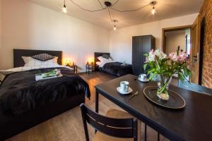 Posteľ alebo postele v izbe v ubytovaní Apartament Wita Stwosza