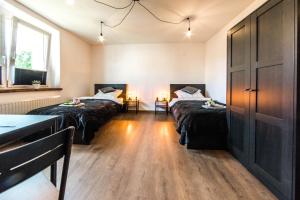Posteľ alebo postele v izbe v ubytovaní Apartament Wita Stwosza