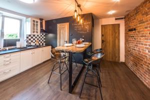 Kuchyňa alebo kuchynka v ubytovaní Apartament Wita Stwosza