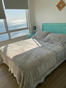 Cama o camas de una habitación en Quilén Apartment