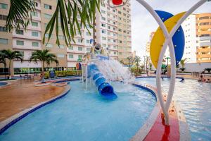 a water slide in a pool in a resort at Riviera Park in Caldas Novas
