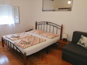 Postel nebo postele na pokoji v ubytování Apartman Mira