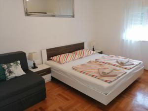 Postel nebo postele na pokoji v ubytování Apartman Mira