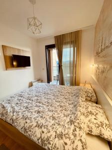 Postelja oz. postelje v sobi nastanitve NEO Apartman