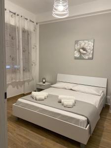 Ένα ή περισσότερα κρεβάτια σε δωμάτιο στο Appartamenti Al Fardella 365