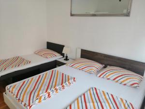 Postel nebo postele na pokoji v ubytování Apartman Mira